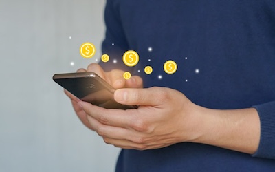 close up young man hand holding smartphone and use currency transfer application to change or make transaction on web for global financial and technology with modern lifestyle concept